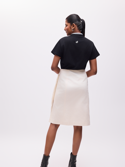 Woman wearing The Groove organic cotton black tshirt with the logo on the reverse